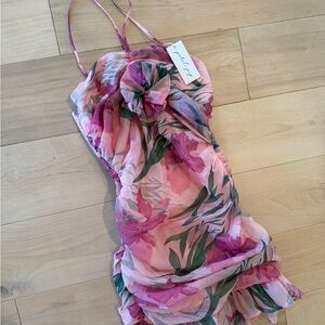 New with tags Floral Pink Dress with Ruffle Details size small. Petal & Pup.